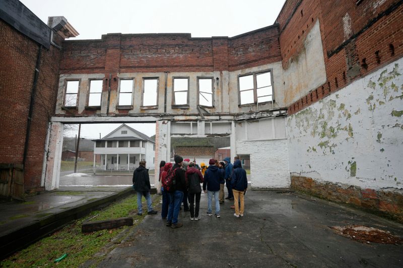A group of architecture students walk through downtown Pocahontas, Virginia, as part of the Appalachian Futures Lab. 